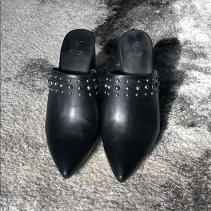 Black pointed high heel mules